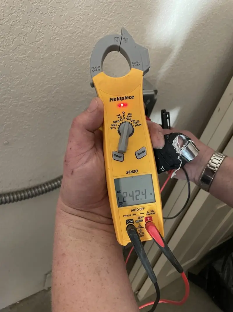 Voltage testing with clamp meter during Ceiling Fan Installation in Allegan